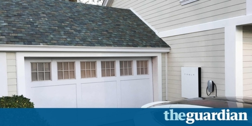 Houses tiled with stylish glass solar roof tiles which mimic ordinary roof tiles